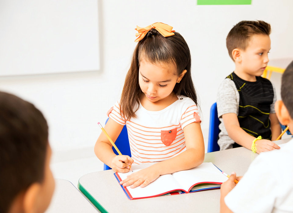 image of a female kid writing